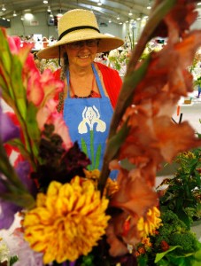 Lakefield and District Horticultural Society member Ann Jakins walks past a floral arrangement during the 36th annual Antique Sale and Flower Show on Wednesday, August 13, 2014 and wraps up Thursday from 10 a.m. to 5 p.m. at the Lakefield-Smith Community Centre. This year's show attracted about 34 antique dealers and over 250 floral exhibits organized by the Lakefield and District Horticultural Society, a non-profit group that raises funds through its annual antique and flower sale o beautify the village of Lakefield. Admission to the show is $5 and children 12 and under are free when accompanied by an adult. Clifford Skarstedt/Peterborough Examiner/QMI Agency 